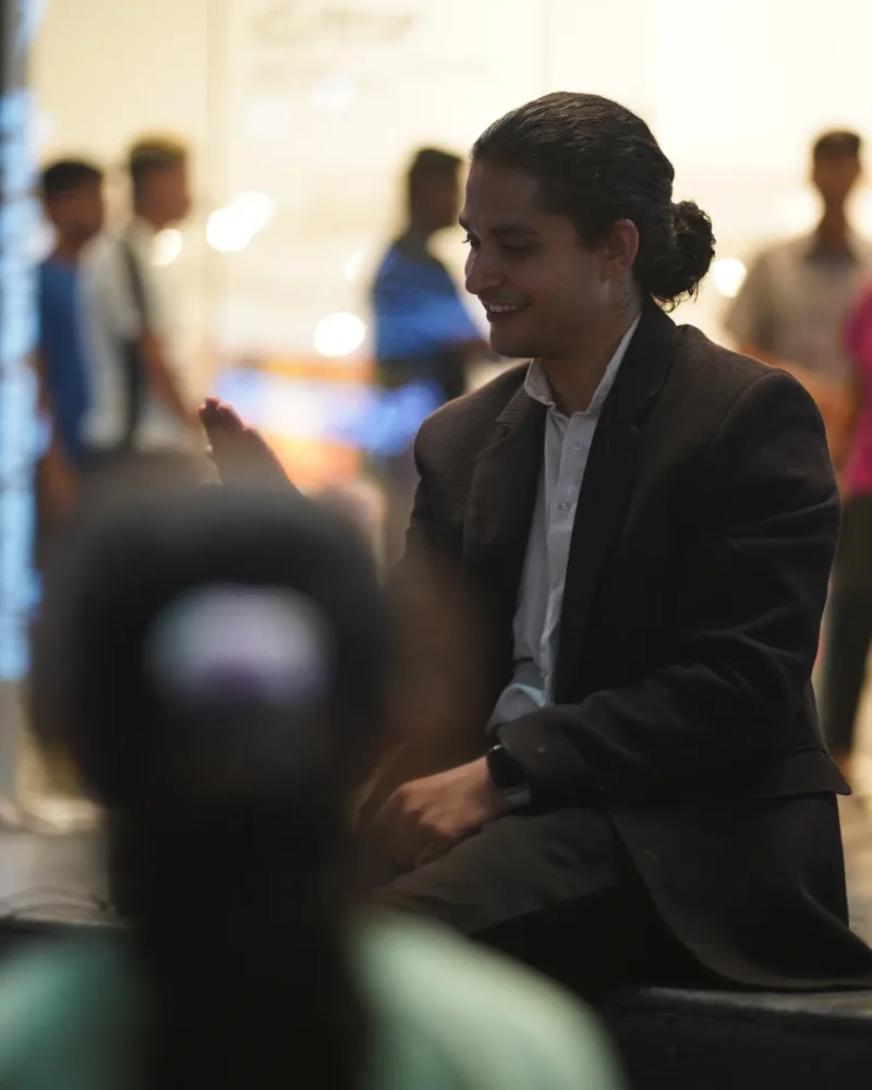 B.S.E. Nukkad Natak: I make a seated gesture during the performance