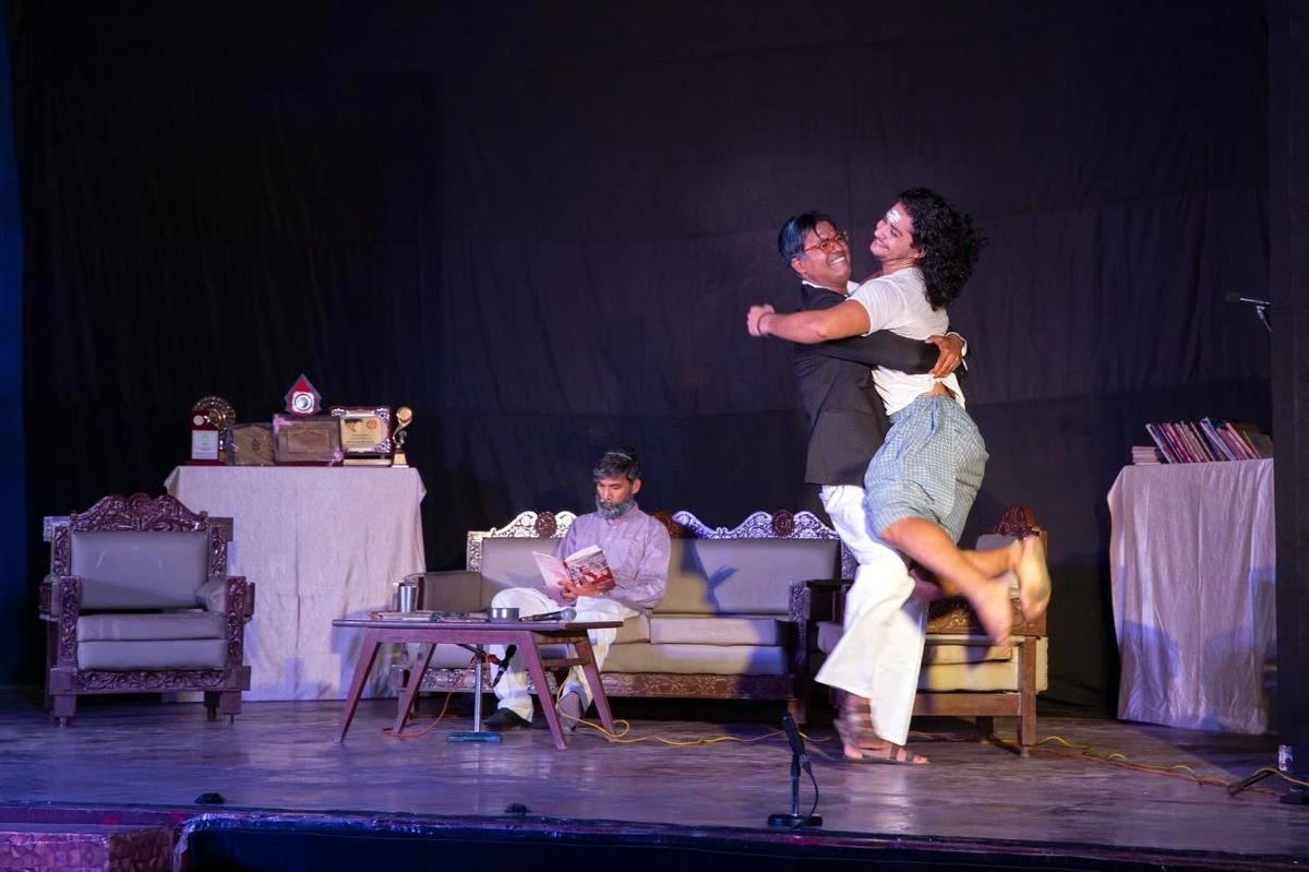 I jump into an embrace with another performer on stage