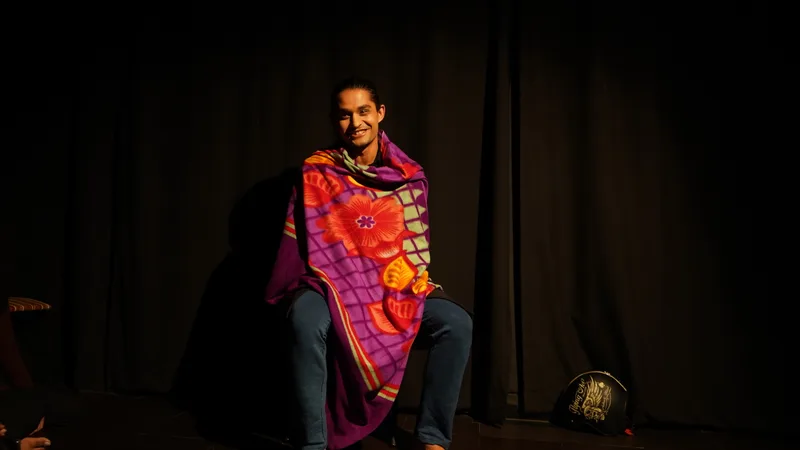 Tell Me Your Story: I am smiling, wrapped in a colourful blanket