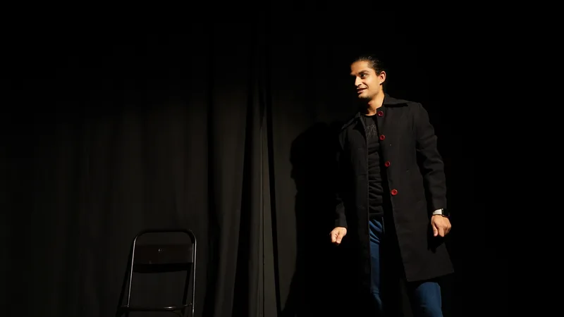 Tell Me Your Story: An exchange in front of the black stage curtain